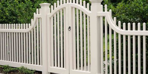 White-picket-fence-with-a-curved-top-gate